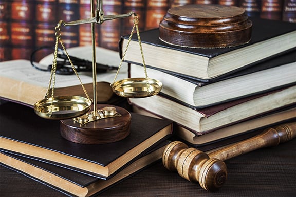 law books with gavel and scale